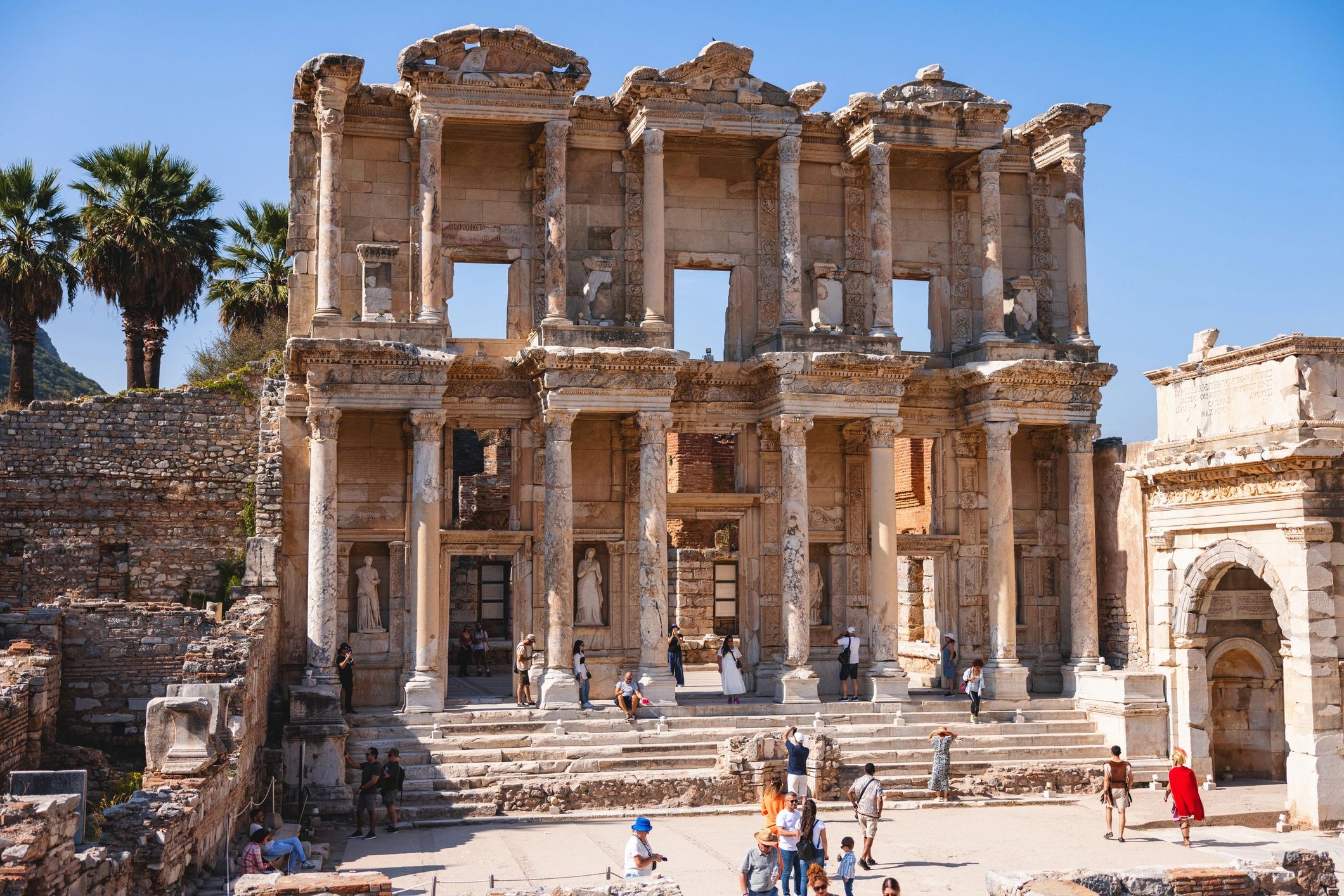 Library of Celsus in Ephesus with visitors.