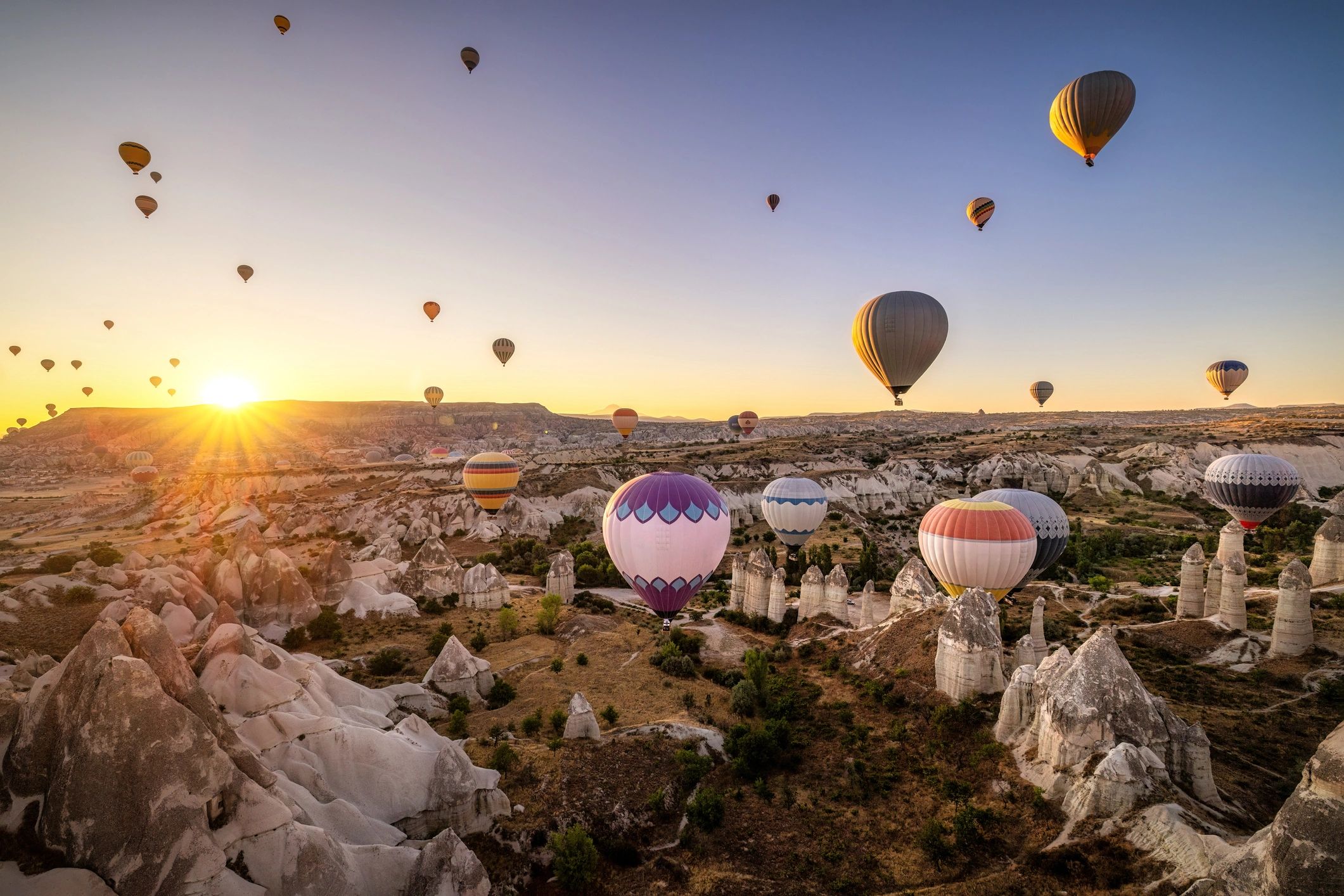 Hot air balloons over Cappadocia at sunrise