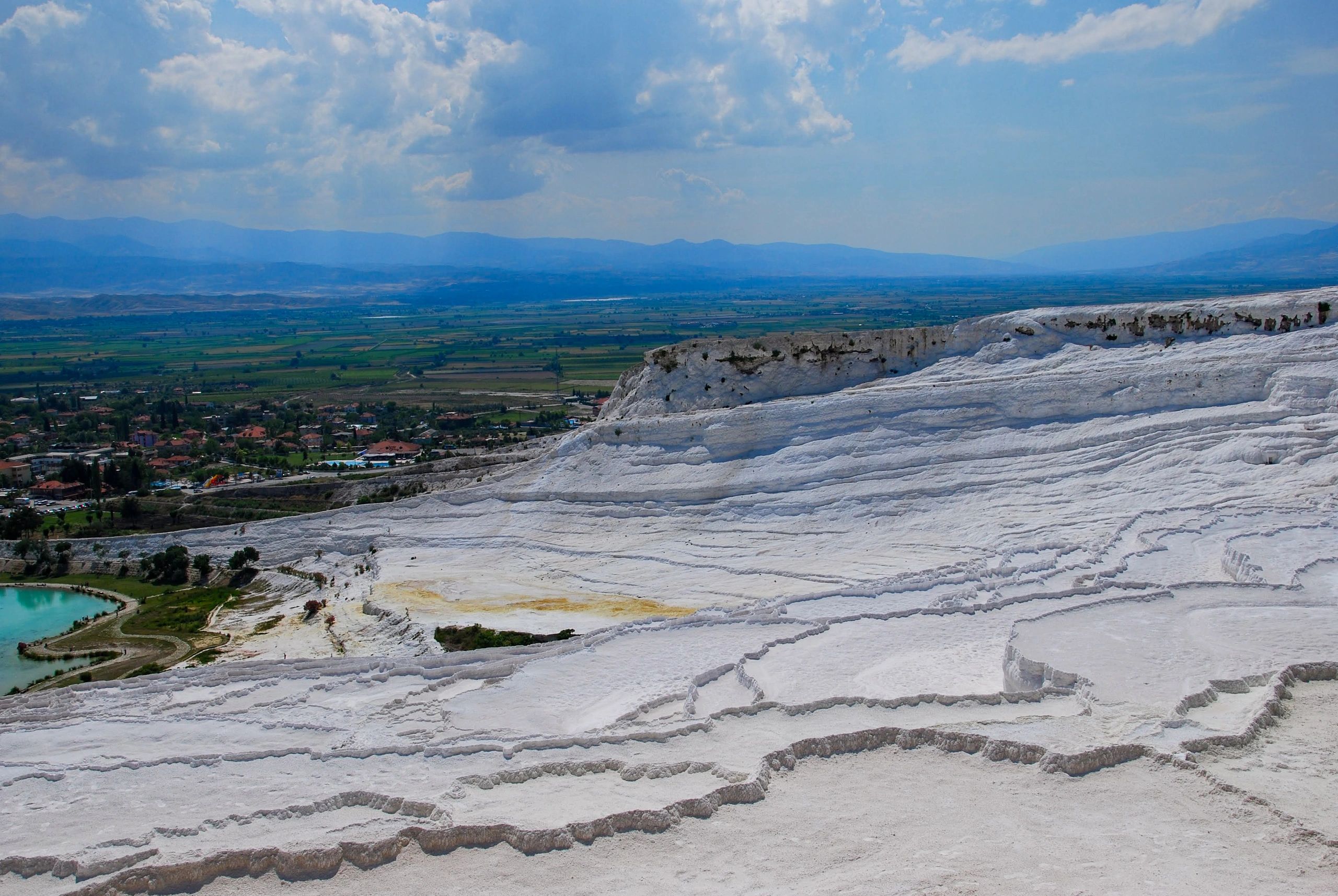 White travertine terraces of Pamukkale overlooking the valley