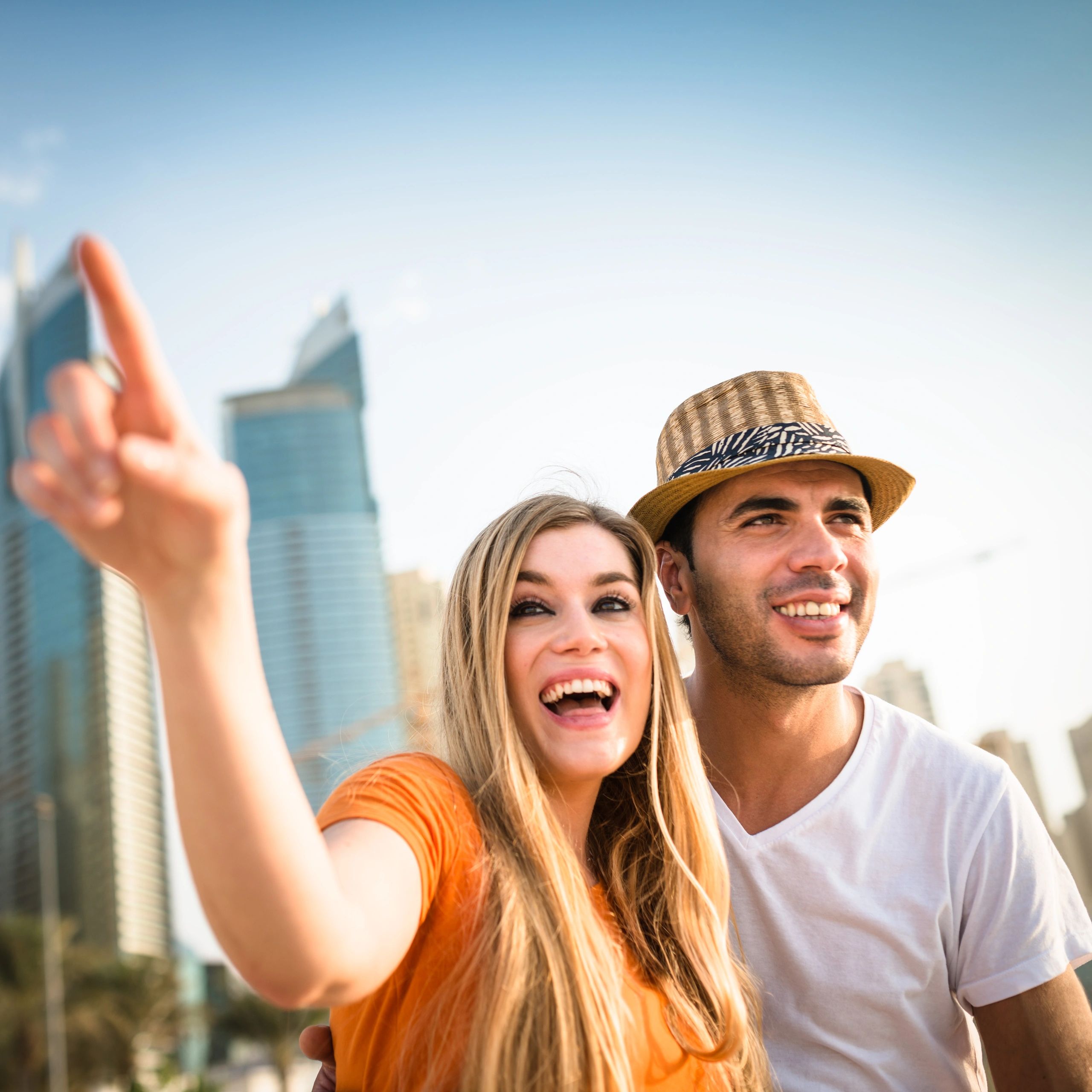 Couple traveling together by a marina