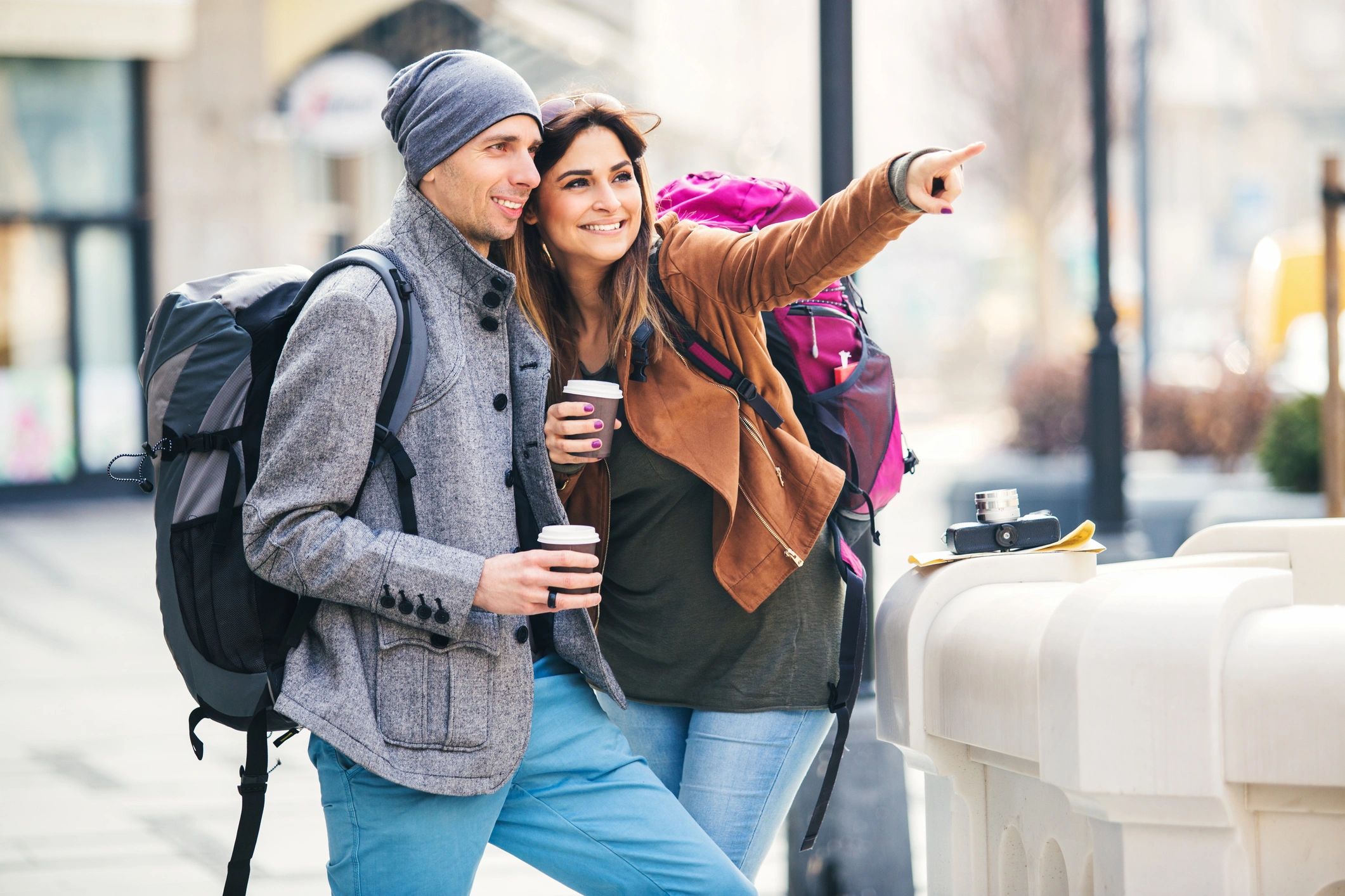 Backpackers reviewing a map on city steps